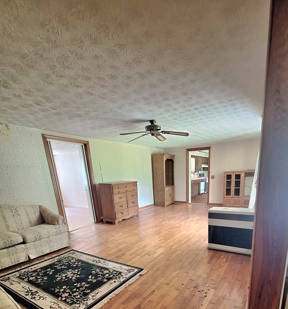 333 Lickskillet Road Epworth, GA 30541 - Photo 2 of 32 a living room with furniture and wooden floor