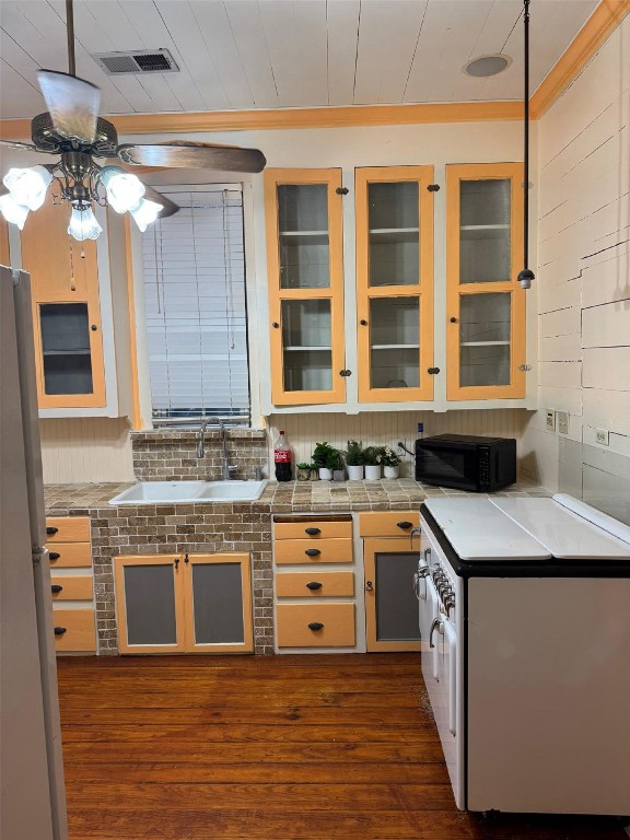5644 Pitts Road Katy, TX 77493 - Photo 24 of 31 a kitchen with stainless steel appliances granite countertop a sink and dishwasher a stove top oven with wooden floor