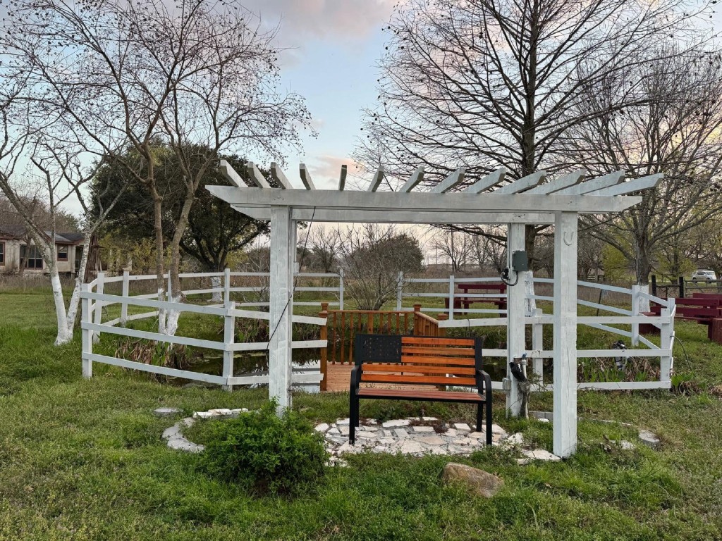 5644 Pitts Road Katy, TX 77493 - Photo 5 of 31 a wooden bench sitting in front of a house