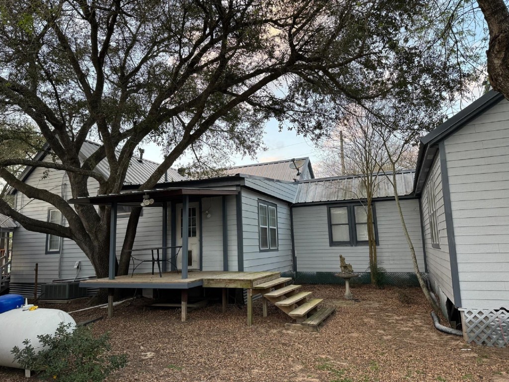 5644 Pitts Road Katy, TX 77493 - Photo 6 of 31 a backyard of a house with barbeque oven and outdoor seating