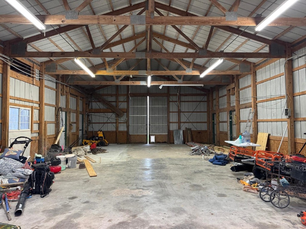 5644 Pitts Road Katy, TX 77493 - Photo 8 of 31 a view of a garage with a bike and wooden roof