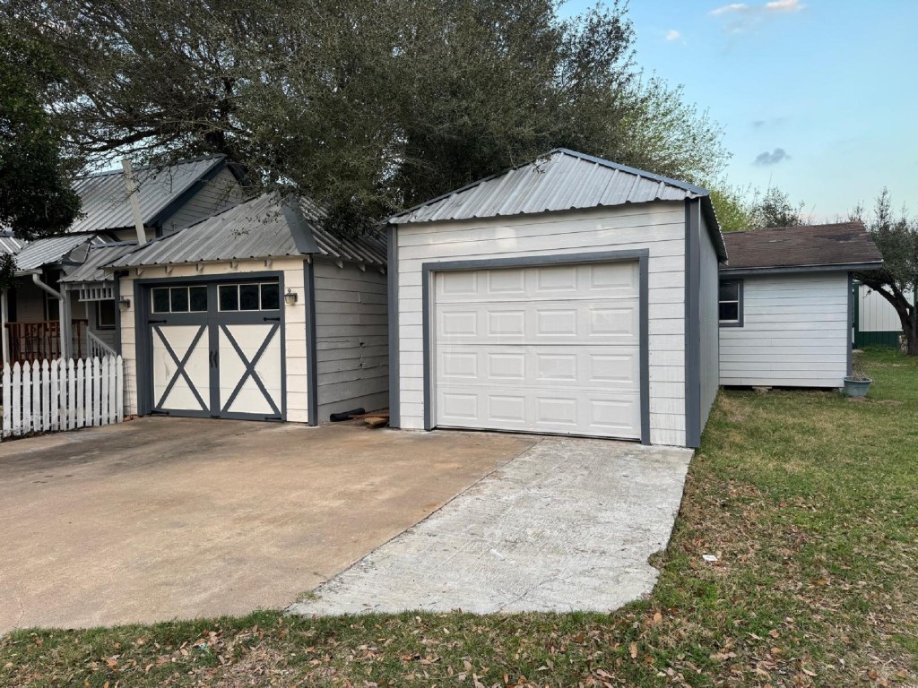5644 Pitts Road Katy, TX 77493 - Photo 9 of 31 a front view of a house with a yard and garage