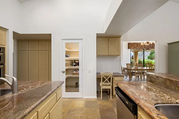 a kitchen with stainless steel appliances granite countertop a stove and a sink