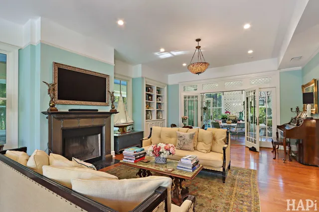 a living room with bed furniture and a window