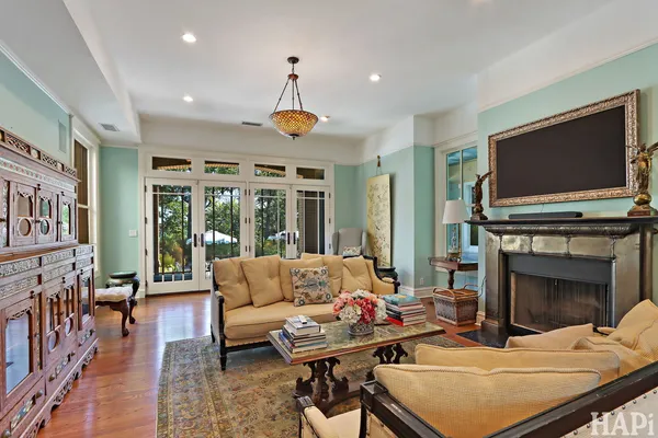 a living room with furniture and a fireplace
