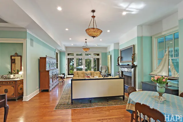 a spacious bedroom with a bed and a dresser