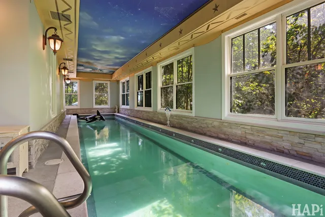 a bathroom with a double vanity sink mirror and shower