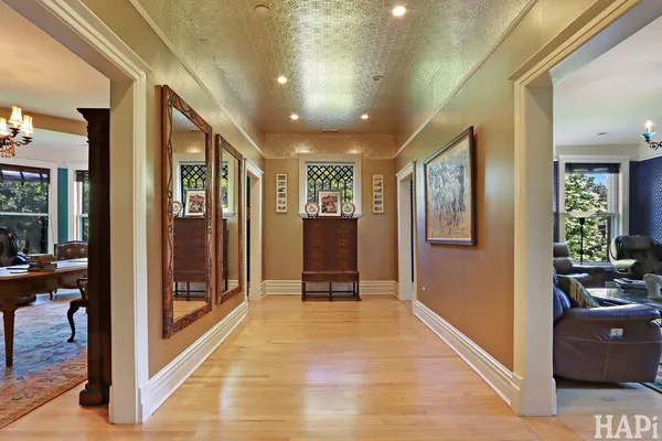a bedroom with furniture and a wooden floor