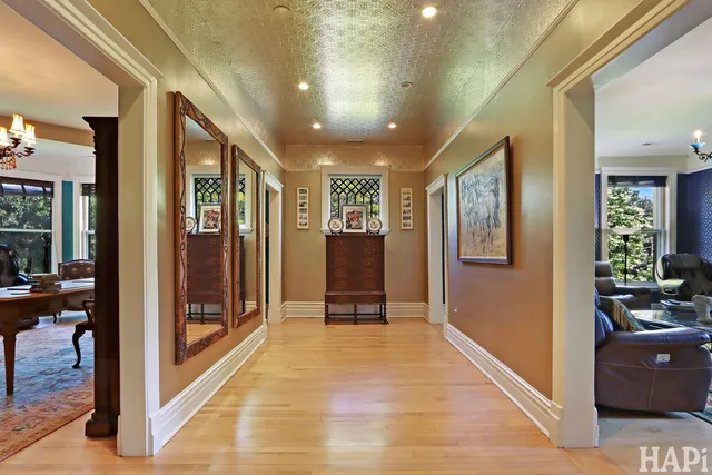 a bedroom with a bed ceiling fan and a window