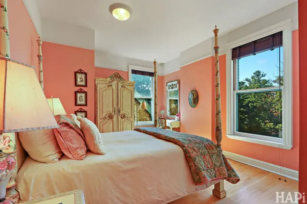 a room with furniture pool table and window