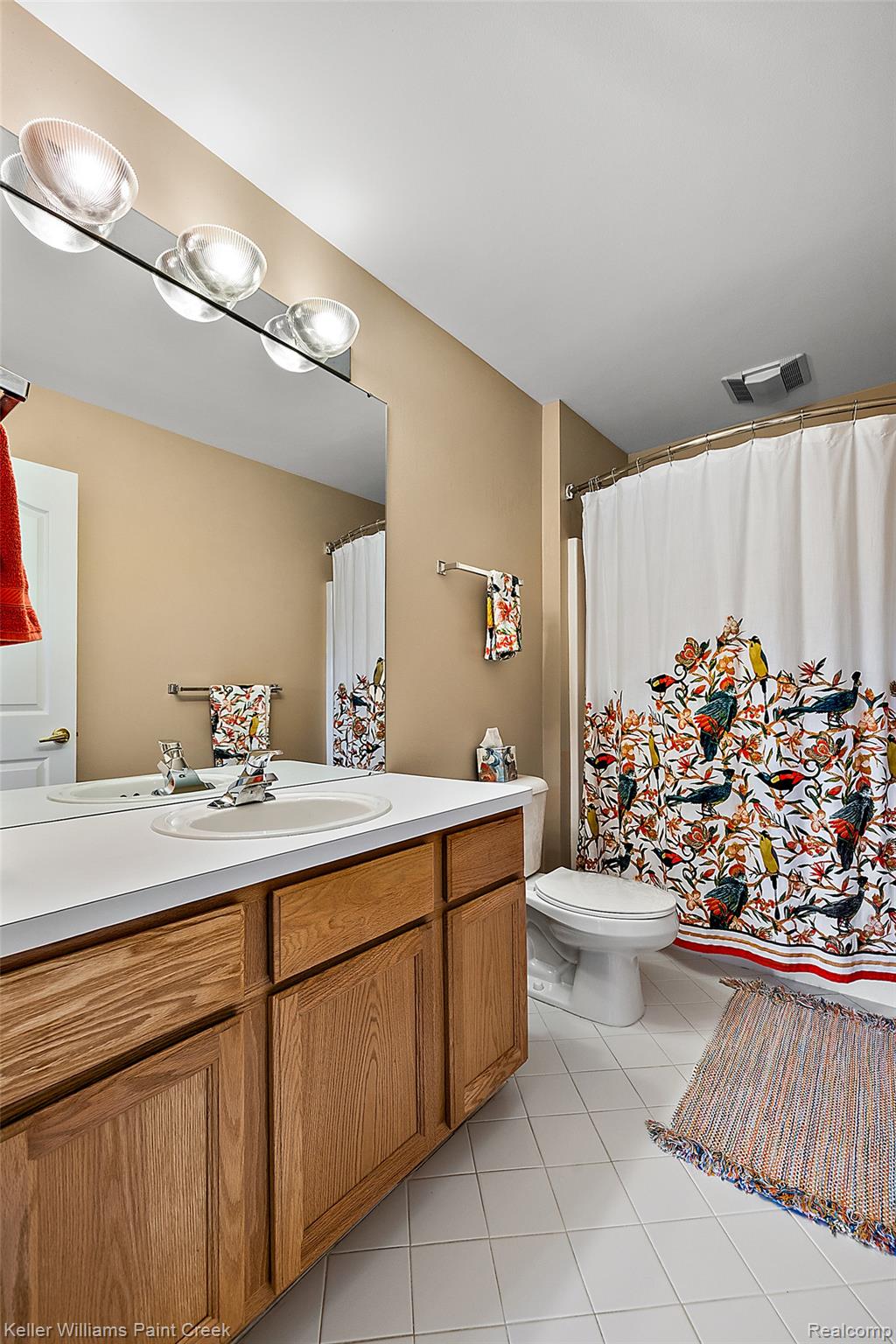 1933 Catlin Drive Rochester, MI 48306 - Photo 38 of 54 Bathroom with light tile patterned floors and vanity