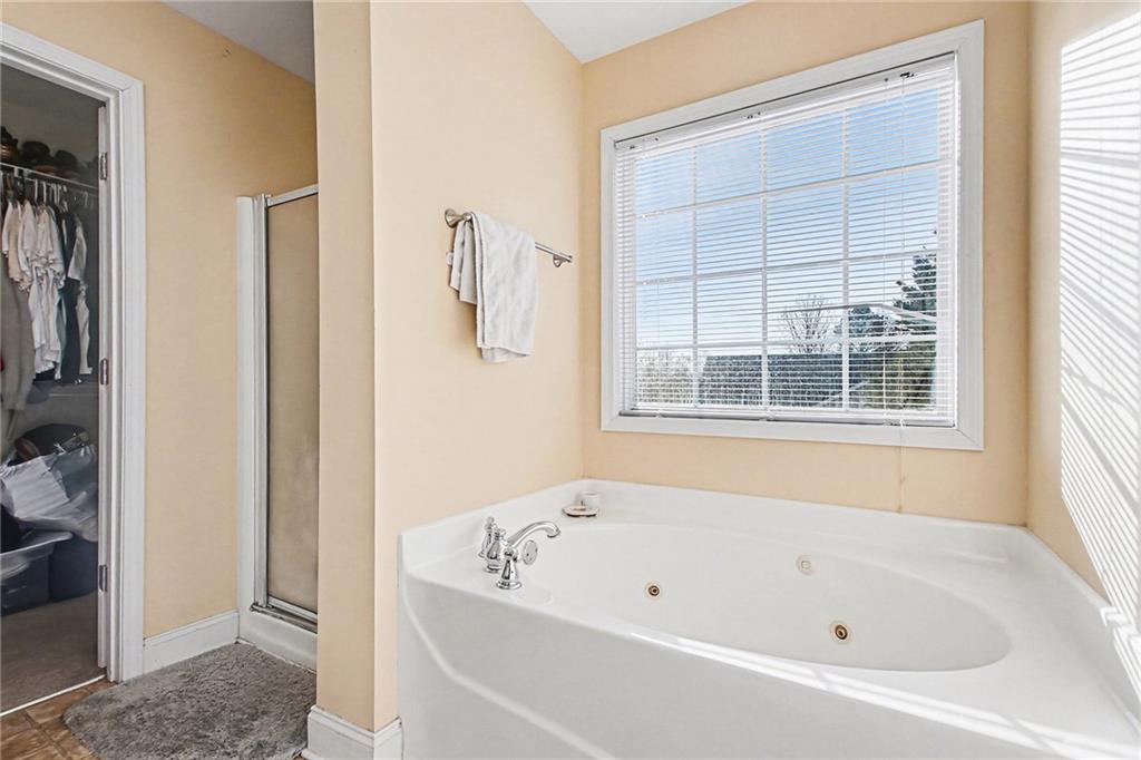 70 Feldspar Drive Jefferson, GA 30549 - Photo 15 of 22 a white bath tub sitting next to a window