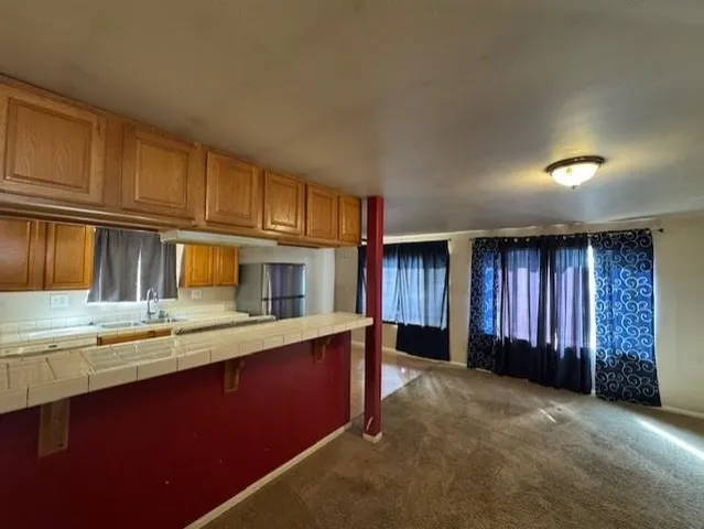 a kitchen with stainless steel appliances granite countertop a sink and cabinets