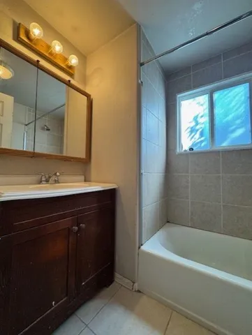 a bathroom with a sink and a bathtub
