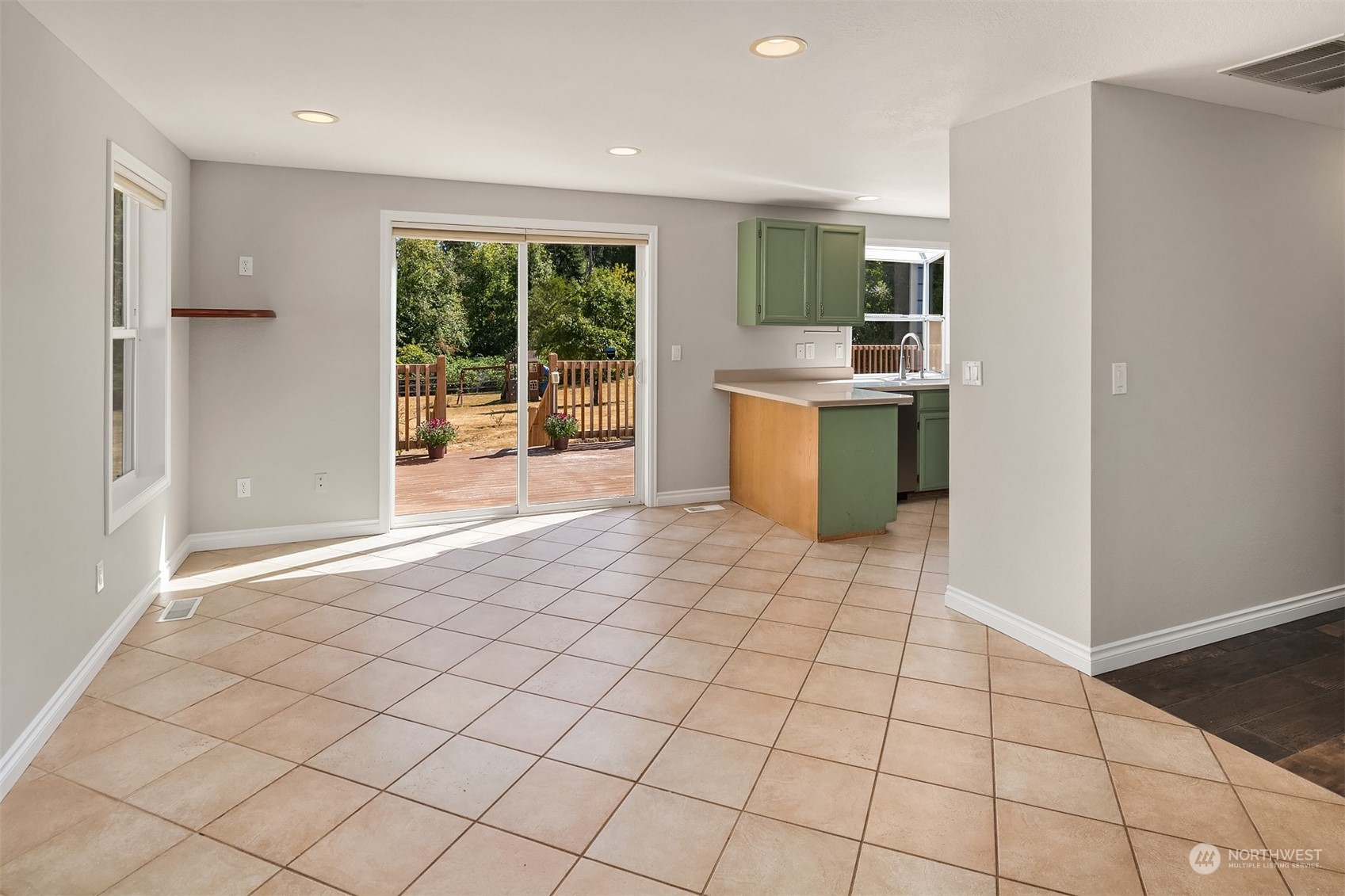 23333 45th Avenue Southeast Bothell, WA 98021 - Photo 15 of 36 a large white kitchen with a sink and cabinets