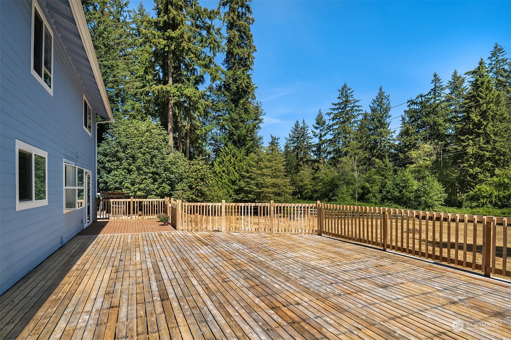 23333 45th Avenue Southeast Bothell, WA 98021 - Photo 34 of 36 a balcony with wooden floor and fence
