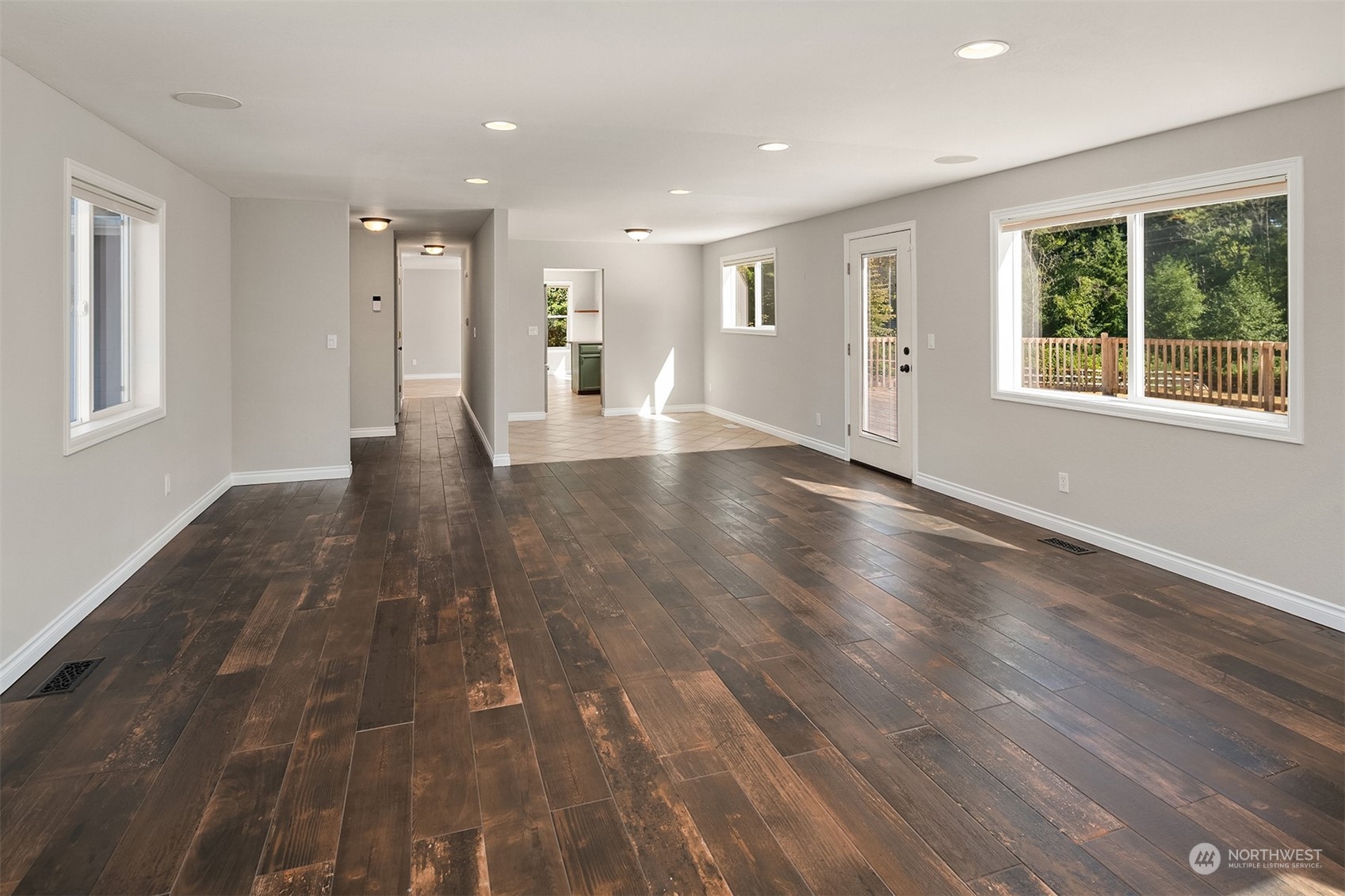 23333 45th Avenue Southeast Bothell, WA 98021 - Photo 9 of 36 a view of an empty room with wooden floor and a window