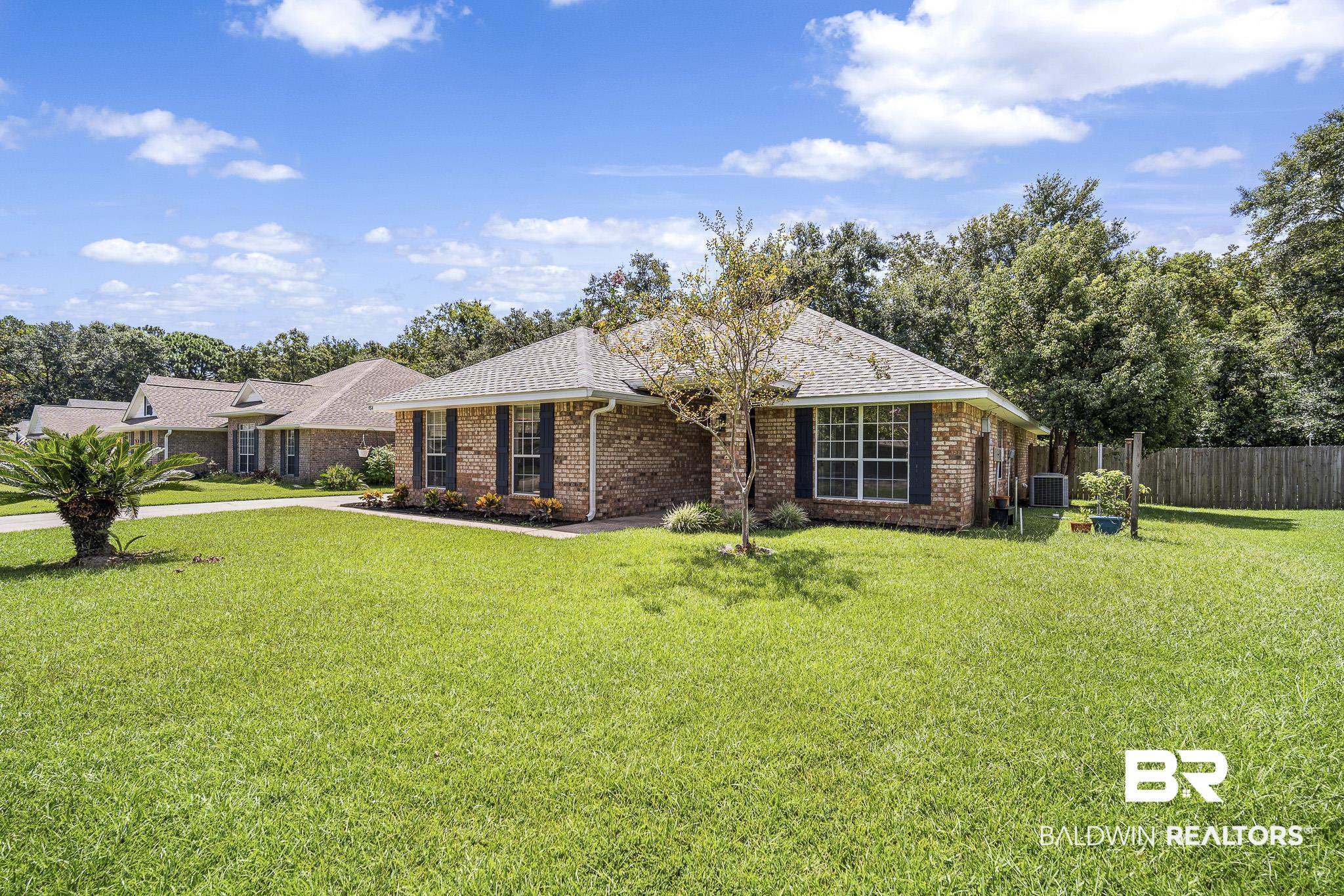 9814 Woolrich Avenue Fairhope, AL 36532 - Photo 26 of 29 Exterior space with a front yard