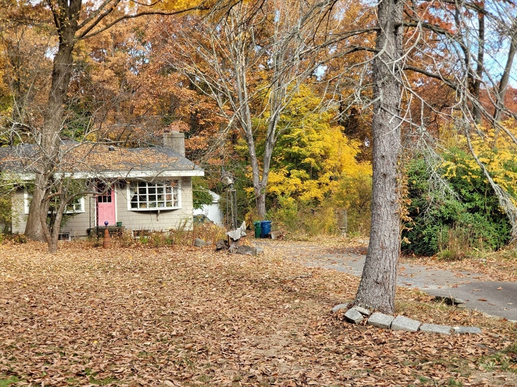 23 Wilmington Road Burlington, MA 01803 - Photo 3 of 6 a front view of a house with a yard