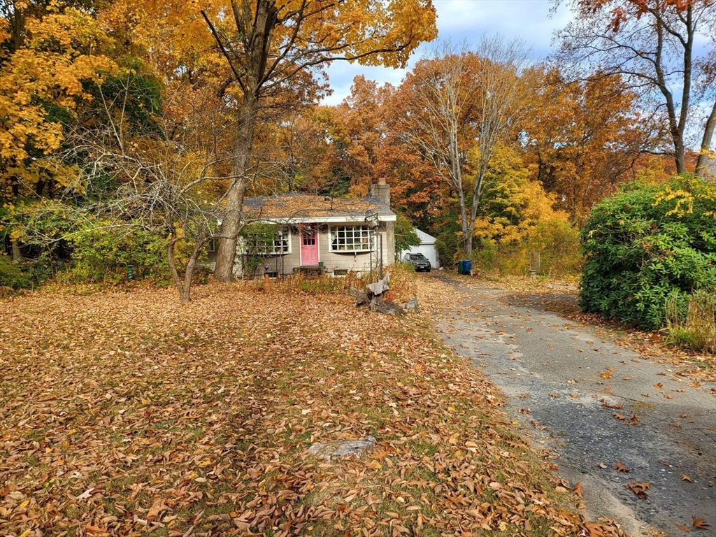 23 Wilmington Road Burlington, MA 01803 - Photo 4 of 6 a view of a house with a yard