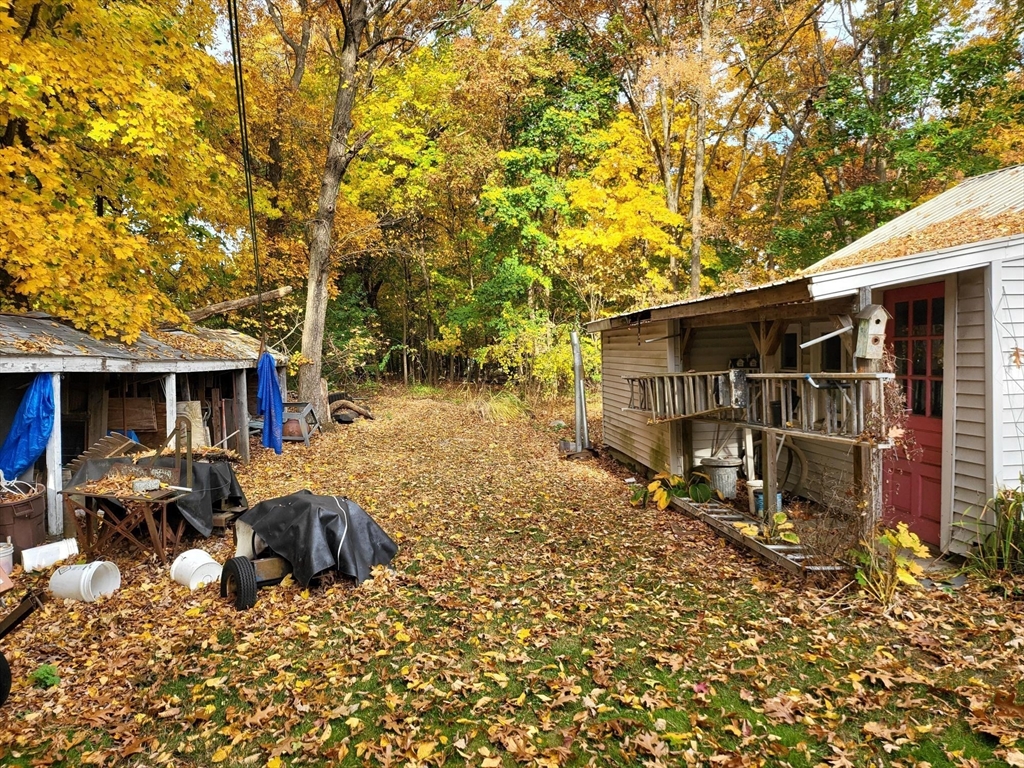 23 Wilmington Road Burlington, MA 01803 - Photo 6 of 6 a backyard of a house with barbeque oven table and chairs
