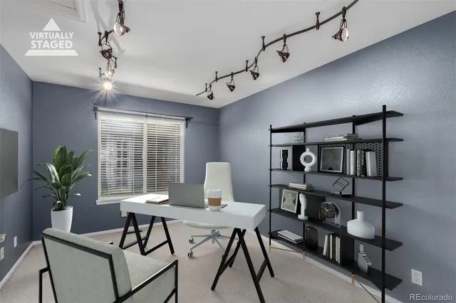 a workspace with furniture and a potted plant