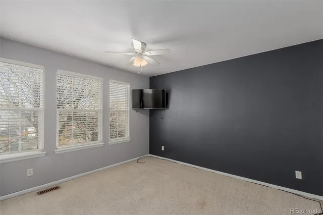 a bathroom with a sink a toilet a mirror a vanity and bathtub
