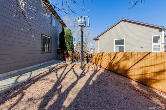 a view of a house with swimming pool and sitting area