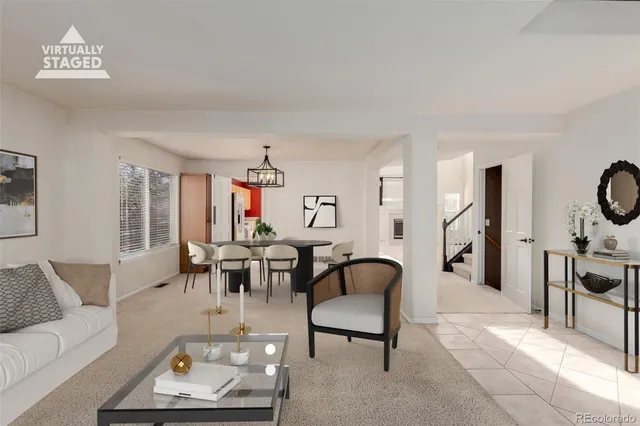 a living room with furniture and a table