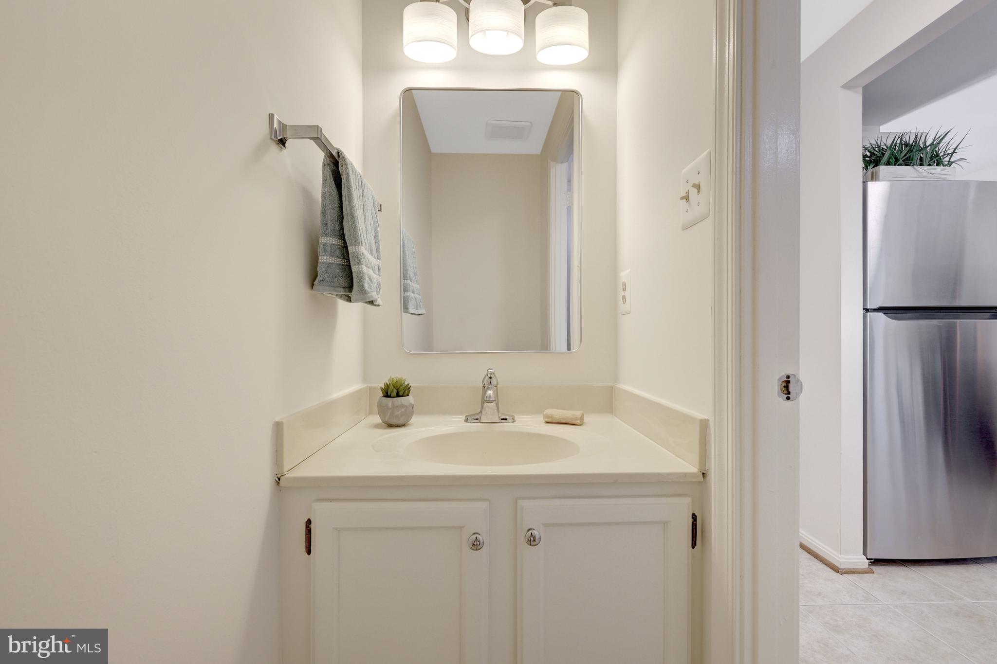 11200 Silentwood Lane Reston, VA 20191 - Photo 24 of 46 a bathroom with a sink and a mirror