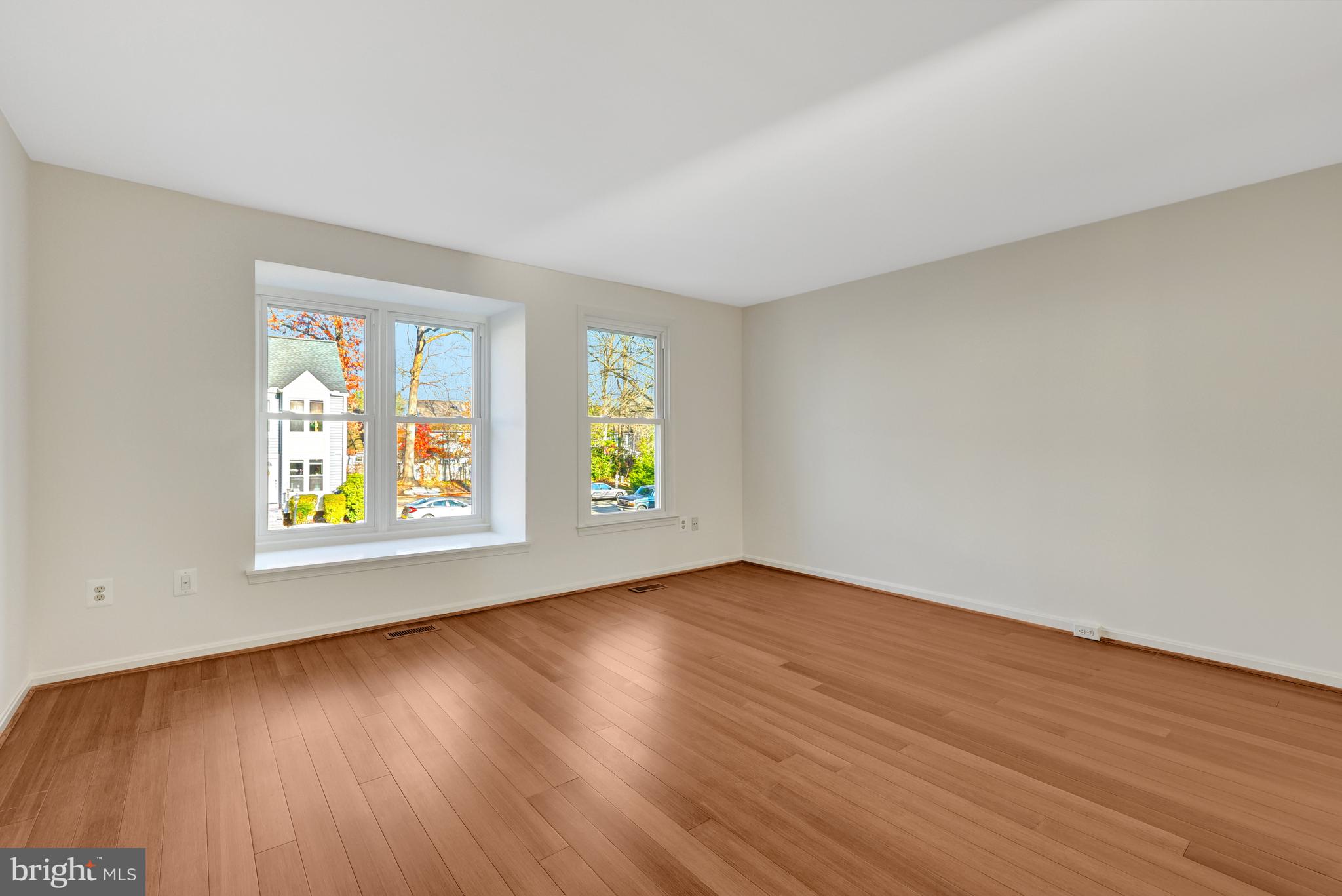 11200 Silentwood Lane Reston, VA 20191 - Photo 27 of 46 an empty room with wooden floor and window