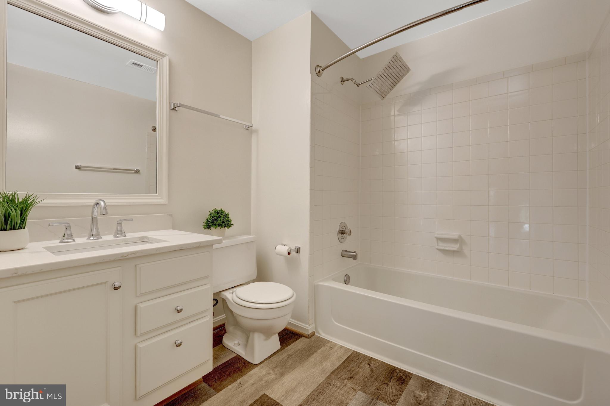 11200 Silentwood Lane Reston, VA 20191 - Photo 38 of 46 a bathroom with a sink toilet and shower