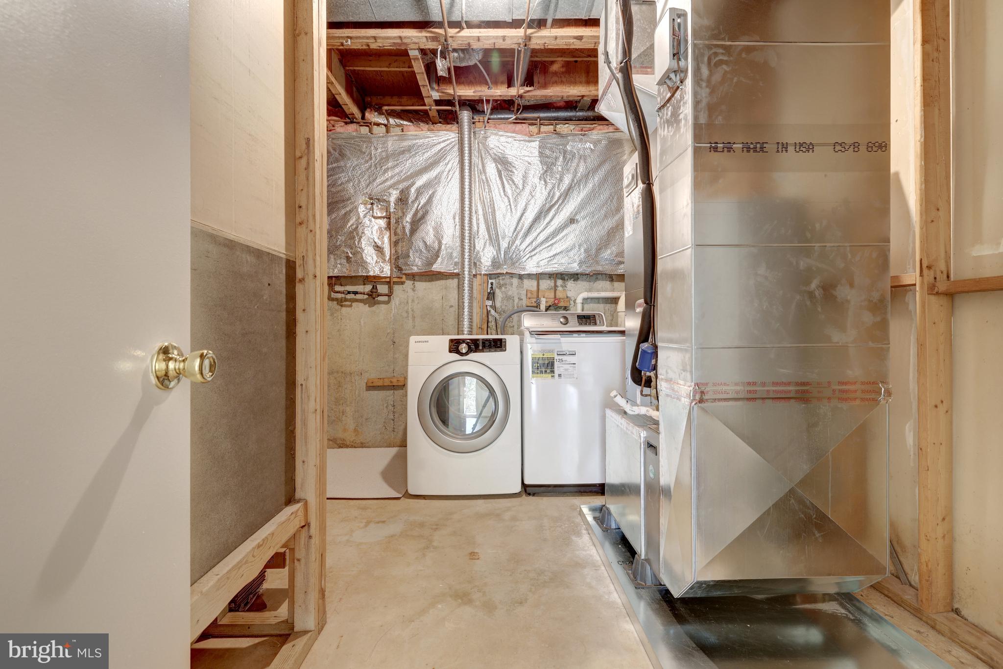11200 Silentwood Lane Reston, VA 20191 - Photo 40 of 46 a utility room with dryer and washer