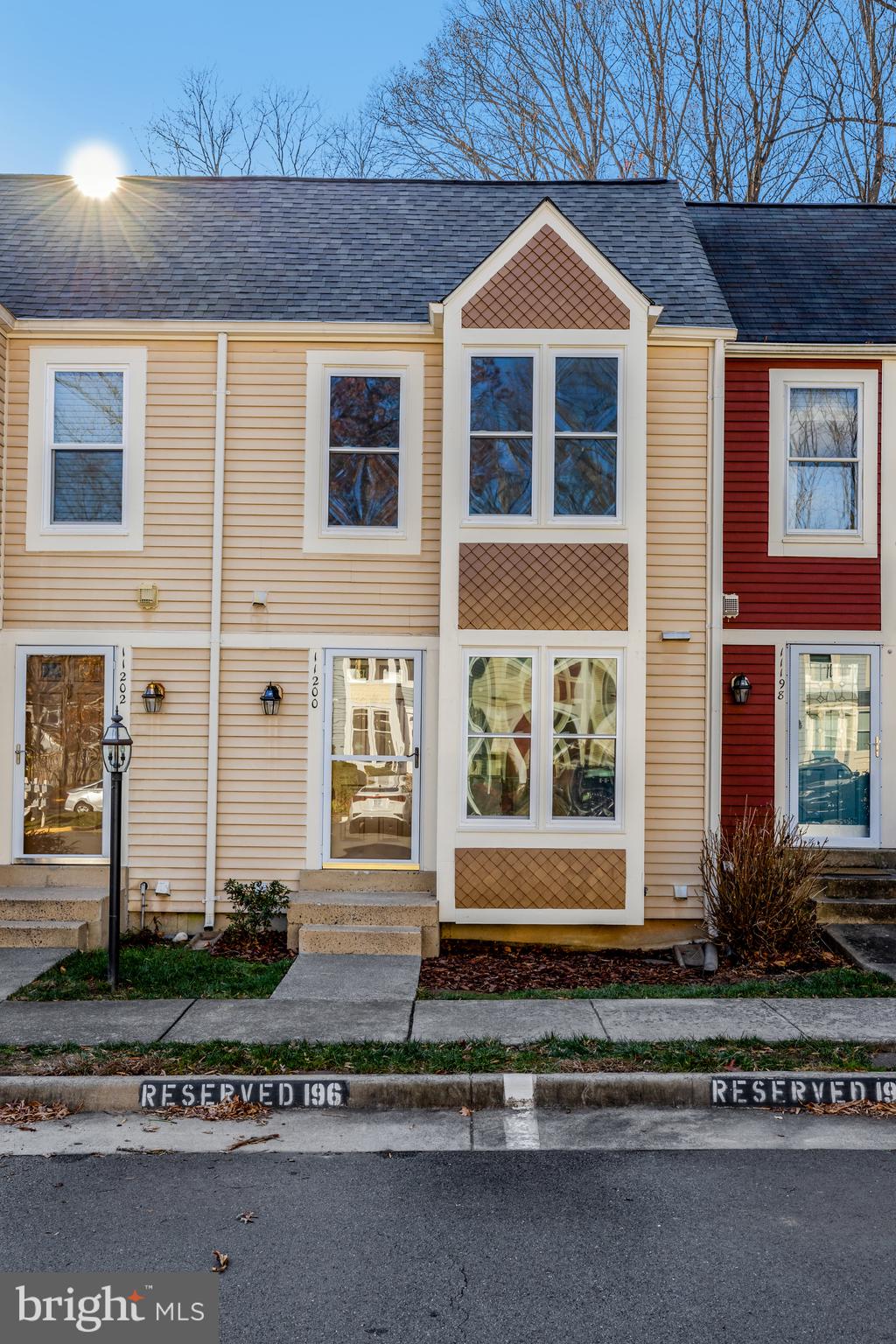 11200 Silentwood Lane Reston, VA 20191 - Photo 4 of 46 a front view of a house with a yard