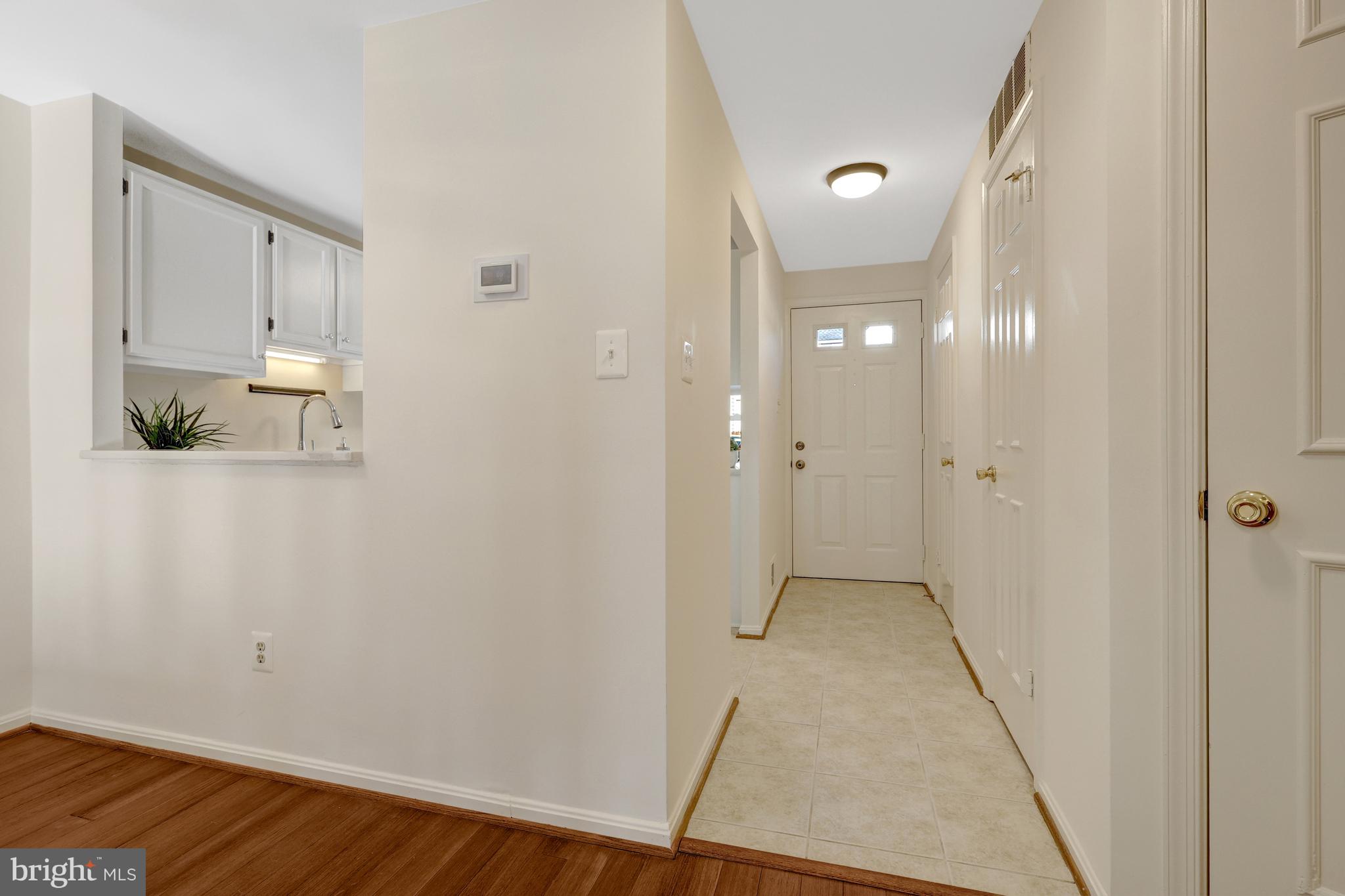 11200 Silentwood Lane Reston, VA 20191 - Photo 7 of 46 a view of a hallway with wooden floor