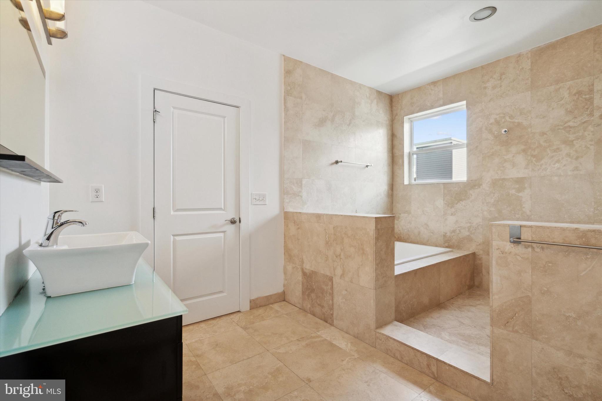 1345 Palethorp Street Philadelphia, PA 19122 - Photo 12 of 15 a bathroom with a bathtub sink and toilet