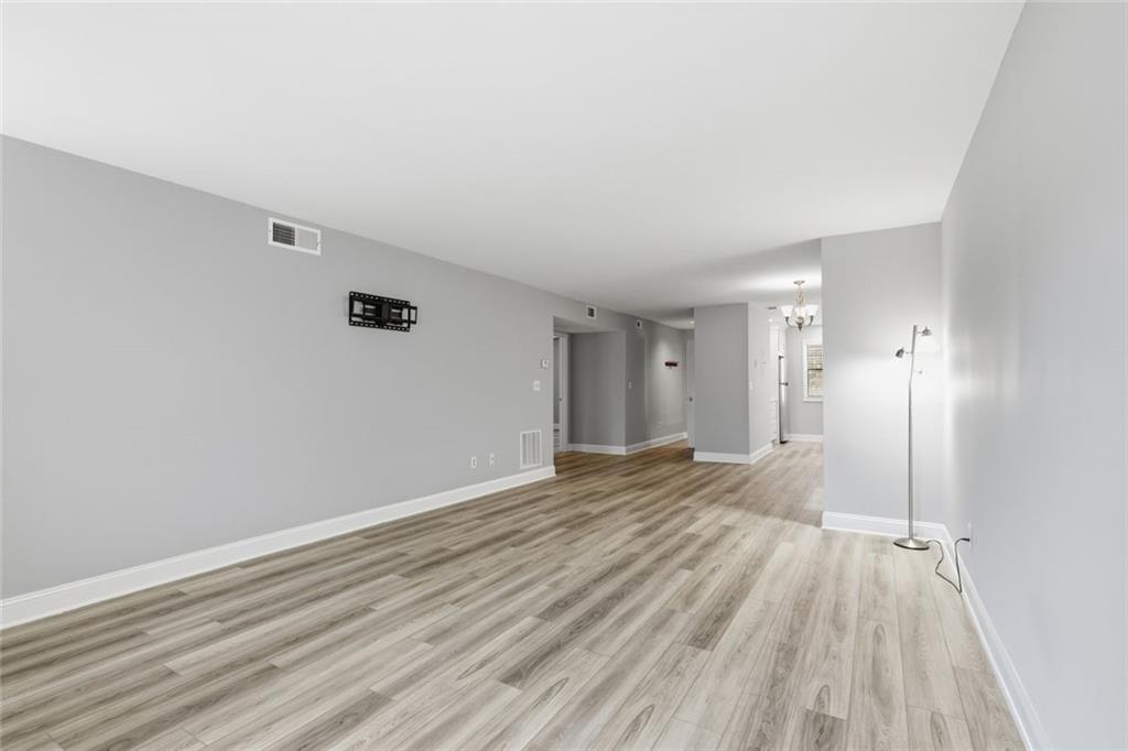 210 Appleby Drive, Unit 119 Athens, GA 30605 - Photo 17 of 35 wooden floor in an empty room with a window