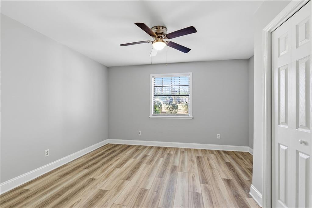 210 Appleby Drive, Unit 119 Athens, GA 30605 - Photo 19 of 35 wooden floor in an empty room with a window