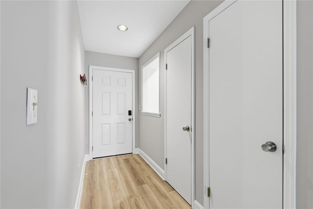 210 Appleby Drive, Unit 119 Athens, GA 30605 - Photo 8 of 35 a view of a hallway with wooden floor