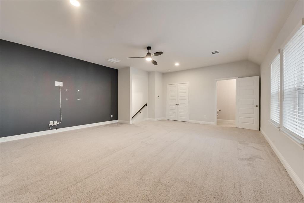 14623 Prairie Fire Drive Frisco, TX 75033 - Photo 20 of 36 an empty room with a ceiling fan and window