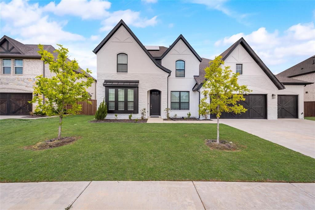 14623 Prairie Fire Drive Frisco, TX 75033 - Photo 2 of 36 a front view of a house with a garden
