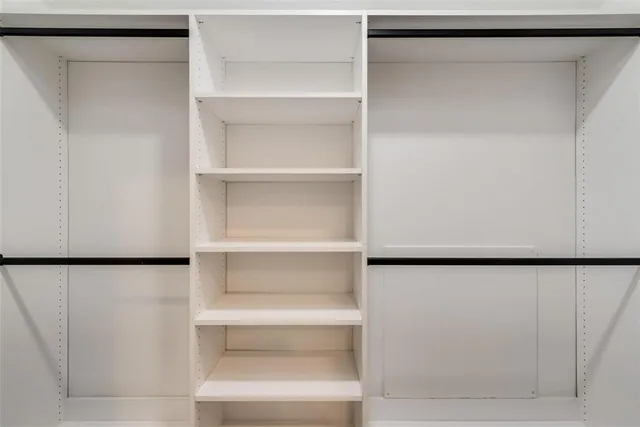 a view of an empty walk in closet