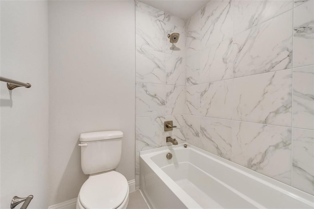 14623 Prairie Fire Drive Frisco, TX 75033 - Photo 24 of 36 a bathroom with a toilet and bathtub