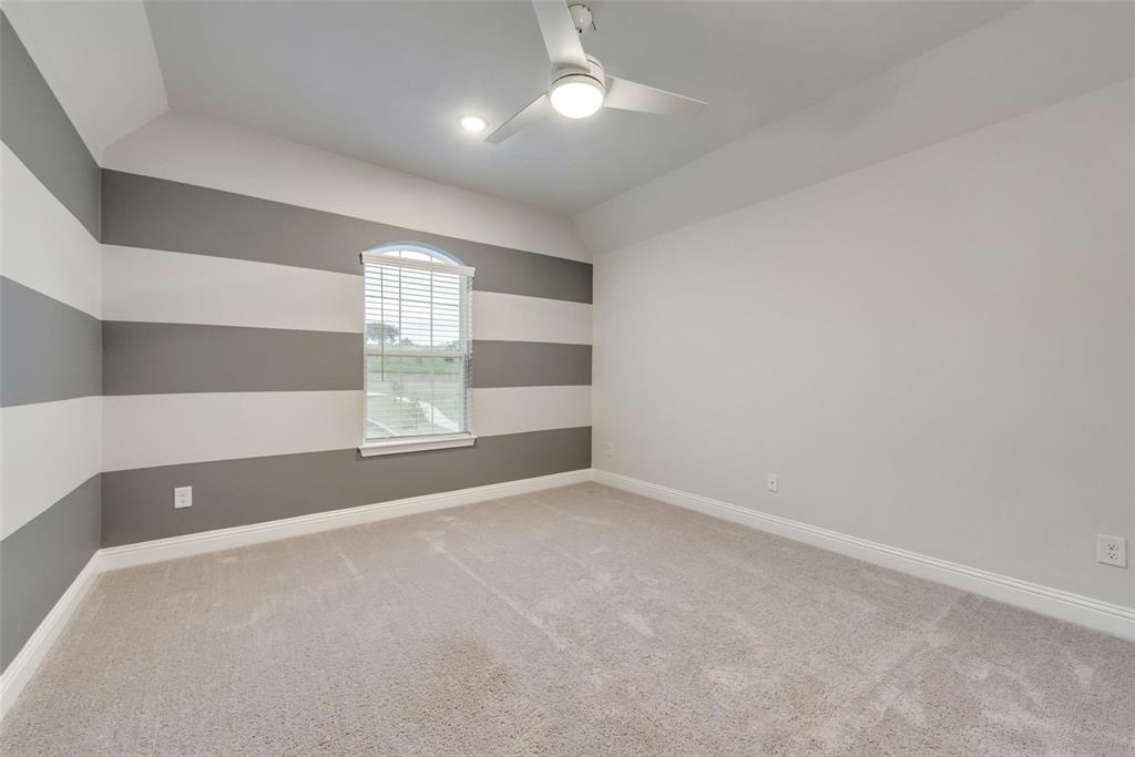 14623 Prairie Fire Drive Frisco, TX 75033 - Photo 25 of 36 a view of an empty room with windows and chandelier fan