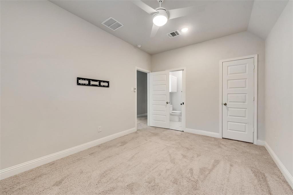14623 Prairie Fire Drive Frisco, TX 75033 - Photo 27 of 36 an empty room with closet and windows