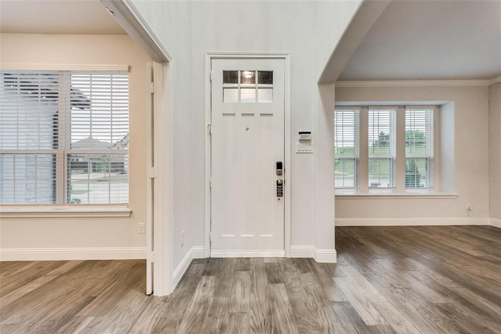 14623 Prairie Fire Drive Frisco, TX 75033 - Photo 3 of 36 an empty room with wooden floor and windows