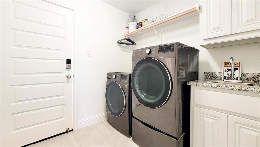 14623 Prairie Fire Drive Frisco, TX 75033 - Photo 31 of 36 a utility room with dryer and washer