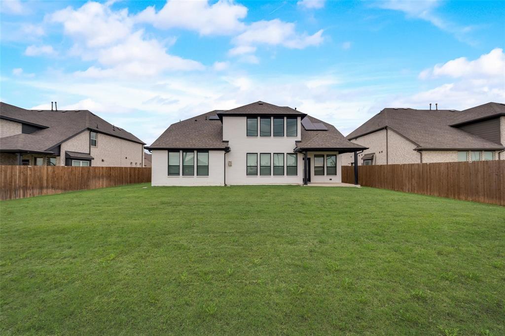 14623 Prairie Fire Drive Frisco, TX 75033 - Photo 33 of 36 a view of a big house with a big yard and large trees