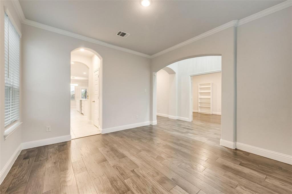 14623 Prairie Fire Drive Frisco, TX 75033 - Photo 7 of 36 an empty room with wooden floor and windows