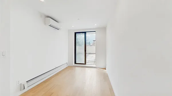 a view of an empty room and window